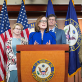 Rep. Salinas Speaking at a Podium