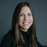 A headshot of Caitlin Sticka.