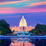 A colorful pink sunset behind the U.S. Capitol.