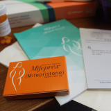 A box of mifepristone on a table.